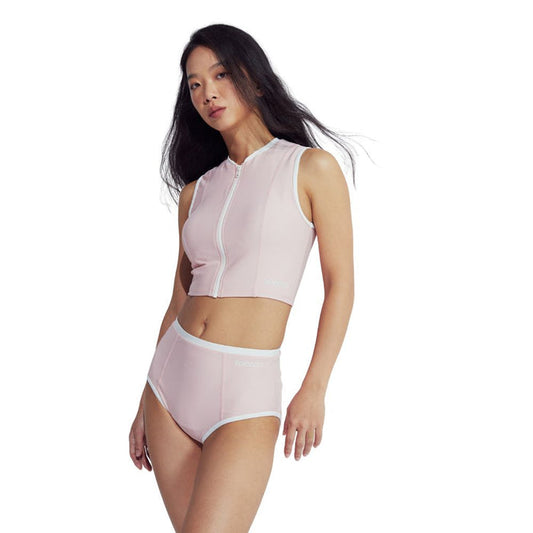 Woman in light pink Speedo Wavechasers 2.0 high-waisted swim bottom with white trim.