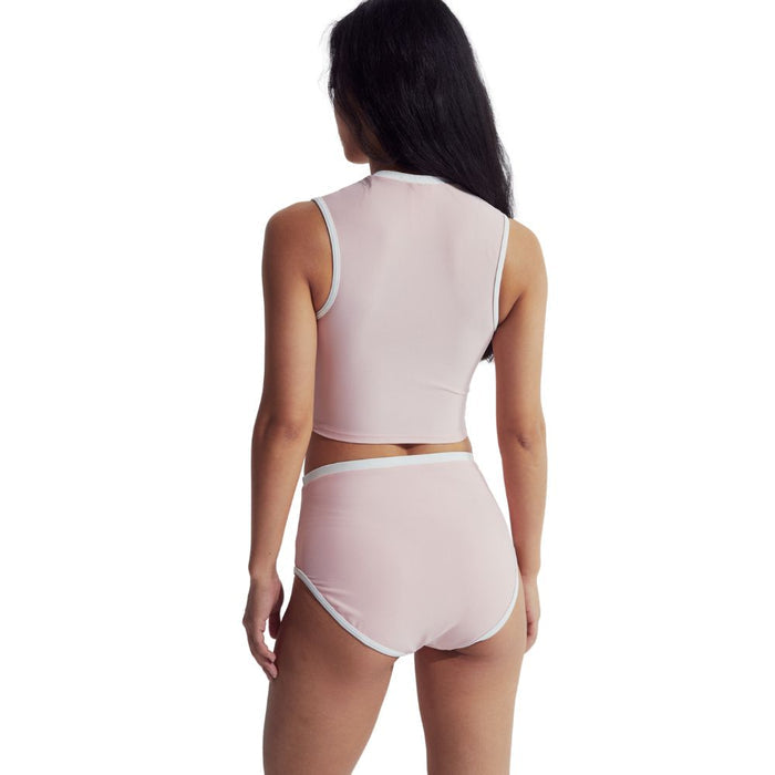 Woman from behind wearing a light pink Speedo Wavechasers 2.0 high-waisted swim bottom with white trim.