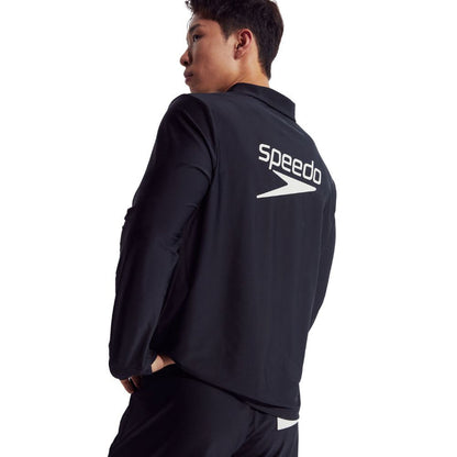 Man wearing a black Speedo Wavechasers 2.0 long-sleeve polo with white logo on back.