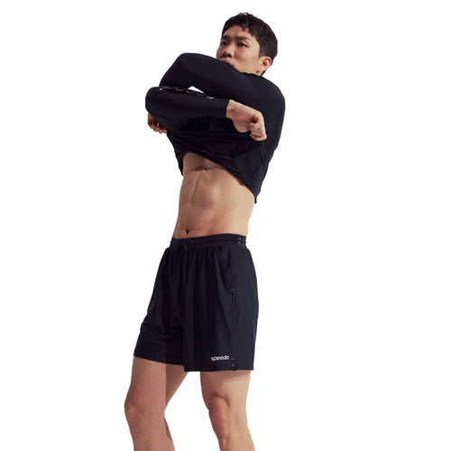 Man wearing black Speedo Wavechasers 2.0 men's watershorts with drawstring waist and side pockets.