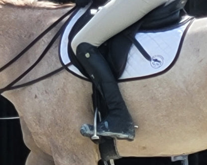 Equestrian rider wearing Boot Jacket horse show boot cover at warmup