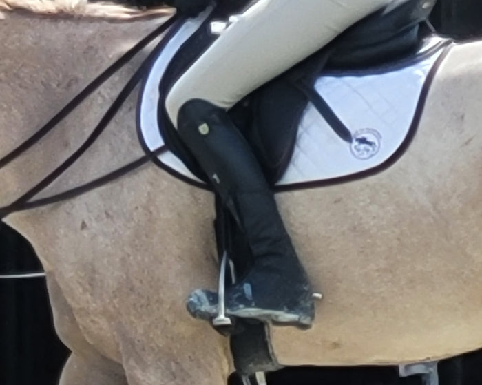 Equestrian rider wearing Boot Jacket horse show boot cover at warmup